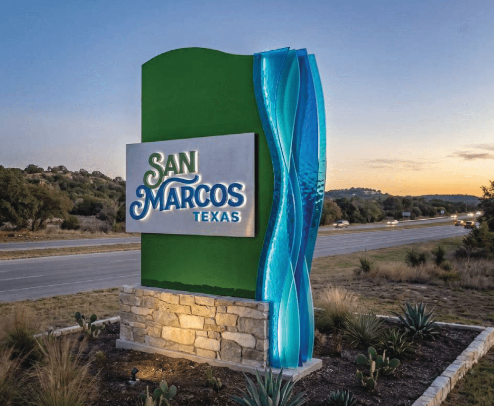 themed gateway sign at night